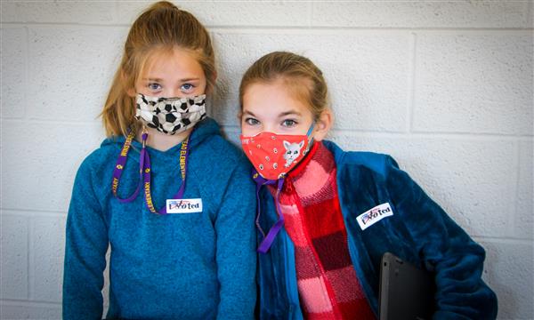Two girls smile